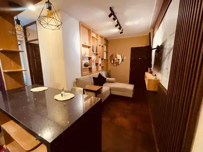 a kitchen and living room with a large counter top at Estancia Ideal in Lima