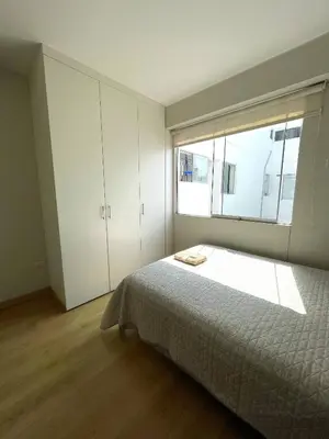 a bedroom with a large bed and a window at Room with 2 beds - Shared Apartment in Lima