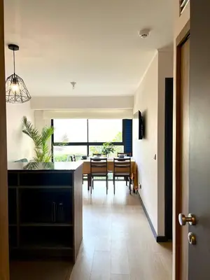 a kitchen and dining room with a dining table at Modern Apartment for 9 San Isidro in Lima