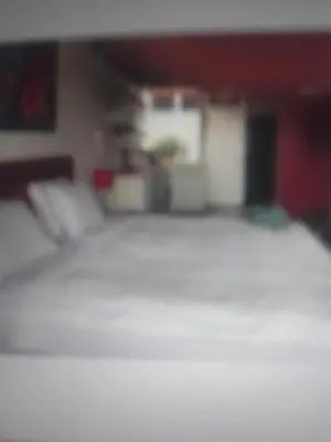 a blurry picture of a bed in a room at Miraflores Effyciency 5to piso in Lima