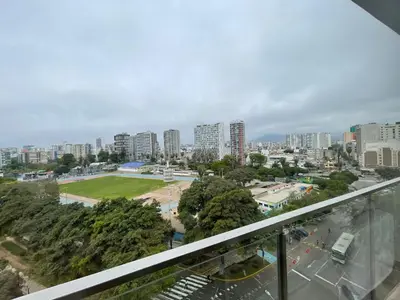 a view of a city from a balcony at BOEM Apartments by Vibrant in Lima