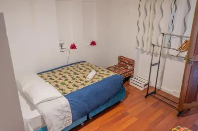 a small bedroom with a bed and a chair at Room A Charming Matrimonial Room in Historic San Blas in Cusco