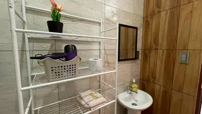 a small bathroom with a sink and a toilet at Departamento en Urubamba in Urubamba