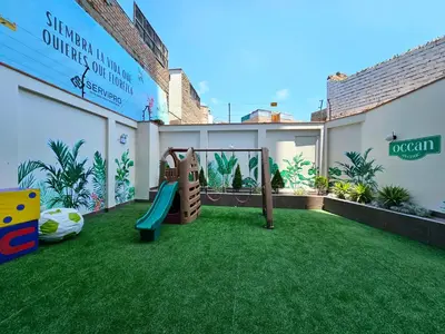 a backyard with a playground with a slide at Apartamento Moderno in Lima