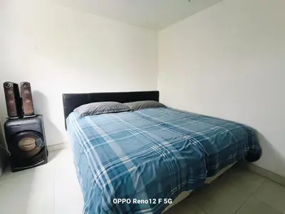 a bedroom with a bed with a blue plaid blanket at Casasol in Santa Rosa