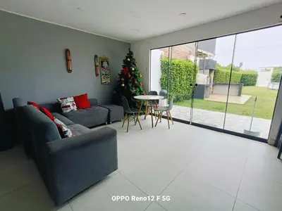 a living room with a couch and a christmas tree at Casasol in Santa Rosa