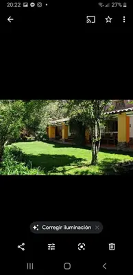 a screenshot of a cell phone of a tree in a yard at EColodge Ccatan in Urubamba