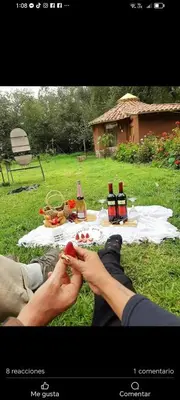 a group of people sitting at a picnic table at EColodge Ccatan in Urubamba