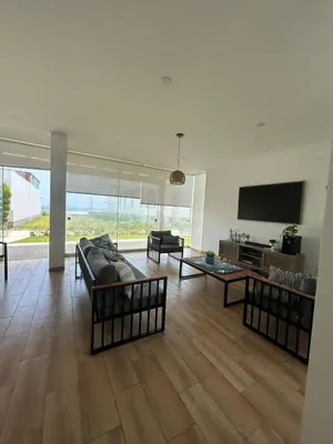 a living room with couches and a flat screen tv at Beach House in Asia, Santorini Condominio in Asia