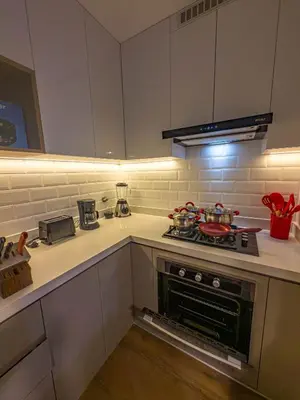 a kitchen with a stove top oven in a kitchen at Brand new apartment in the heart of Miraflores in Lima