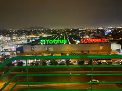 a view of a parking lot at night at New Apartment near the airport with parking in Lima