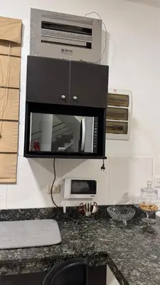 a kitchen with a counter top with a microwave at Casa de Campo Las Siete Gotas - Cieneguilla in Cieneguilla