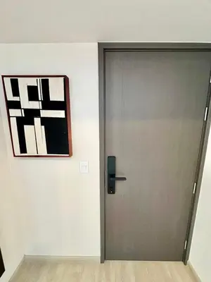 a door in a room with a picture on the wall at Apartment in the center of Miraflores Larco in Lima