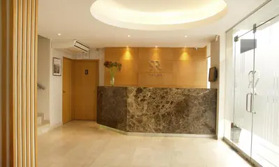 a lobby with a marble counter in a building at Hotel San Remo in Lima