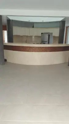 an empty room with a counter in a building at Asia las terrazas casa in Asia