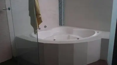 a white bath tub in a bathroom with a shower at Asia las terrazas casa in Asia