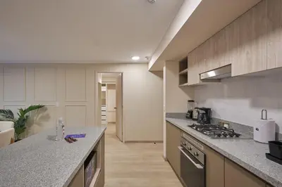 a kitchen with a counter and a stove top oven at Larco Prime Suites - Pool, Gym & Coworking in Lima