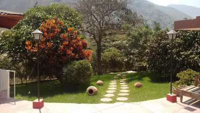 a garden with balls sitting on the grass at Casa de campo Yangas para 20 personas in Yangas