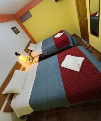 a bedroom with a large bed in a room at Hospedaje San Francisco in Machu Picchu