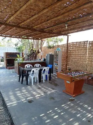 a patio with a ping pong table and a ping pong table at Casa rústica in Ica