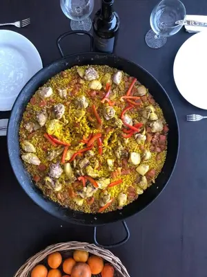 a pan filled with food on top of a table at Country House in Azpitia Villa las Leñas in Santa Cruz de Flores