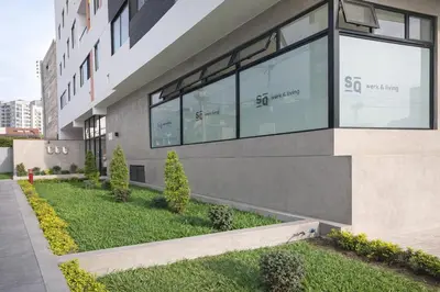 a building with large windows on the side of it at Modern Apartment with AC and Pool near Miraflores, Fast WiFi in Lima