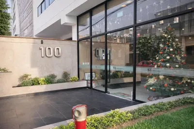 a christmas tree in the courtyard of a building at Modern Apartment with AC and Pool near Miraflores, Fast WiFi in Lima