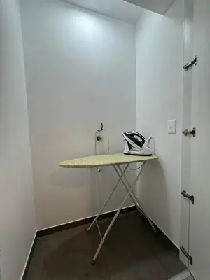 a table in a room with a phone on it at Amalfi Apartment 612 Malecón de la Avenida Costanera in Lima