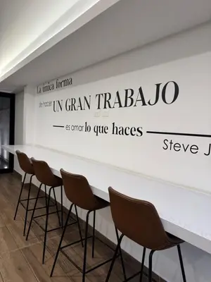 a white wall with a sign that reads in gram traeger and grand no five at Amalfi Apartment 612 Malecón de la Avenida Costanera in Lima