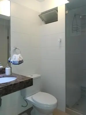 a bathroom with a toilet and a sink at Coliving Barranco in Lima