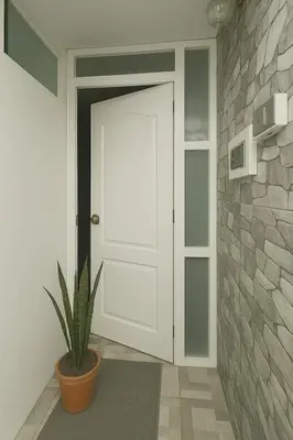 a white door in a room with a potted plant at Habitación en Miraflores completa in Lima