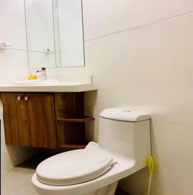 a bathroom with a white toilet and a sink at Mini Depa Luminoso con Cocina, a Pasos del Parque Kennedy Miraflores in Lima