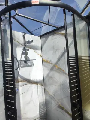 an inside view of a glass iguana cage at Cusco Sana Lodge in Cusco