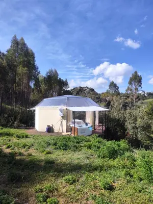 a white tent in the middle of a field at Cusco Sana Lodge in Cusco