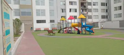 a playground with a slide in the middle of a building at Departamento 4p en condominio Centro de Lima in Lima
