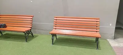 two wooden benches sitting next to each other at Departamento 4p en condominio Centro de Lima in Lima