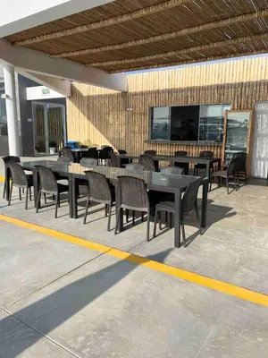 a group of tables and chairs in a building at Casa de Playa en Puerto Viejo in Puerto Viejo