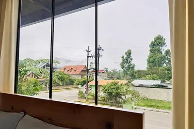 a room with a window with a view of a street at Casa Familiar TOVCA Oxapampa in Oxapampa