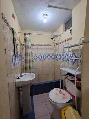 a bathroom with a toilet and a sink at Hostal la familia in Churín