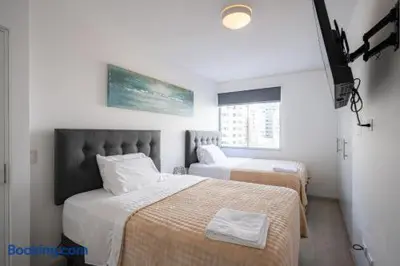 a bedroom with two beds and a window at Barranco-Miraflores 2BR OceanView Modern Apt up to 6 guests! in Lima
