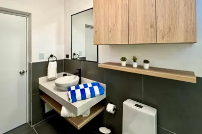 a bathroom with a sink and a mirror at Tiny House con Jacuzzi, Fogata y Starlink in Anta