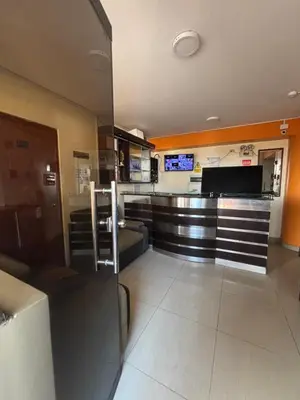 a lobby with a bar in a building at Hospedaje Don Luciano in San Vicente de Cañete