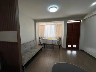 a living room with a couch and a table at Mn Depa en San Bartolo in San Bartolo