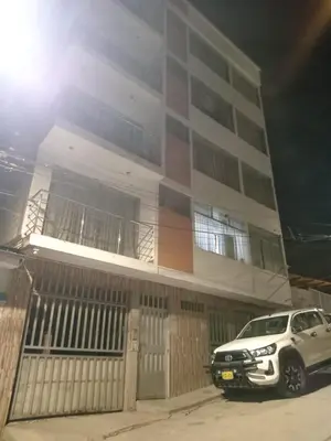 a white car parked in front of a building at Casa Hospedaje Minidepa Piquichas in Abancay