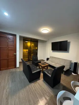 a living room with a couch and a table and chairs at Moderno Mn Depa en San Bartolo in San Bartolo