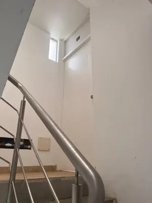 a staircase in a room with a white wall at Departamento 201 in Punta Negra