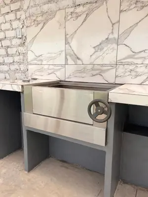 a kitchen counter with a marble counter top at Departamento 201 in Punta Negra