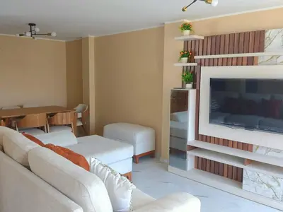 a living room with a couch and a fireplace at Casa Quevedo in Ica