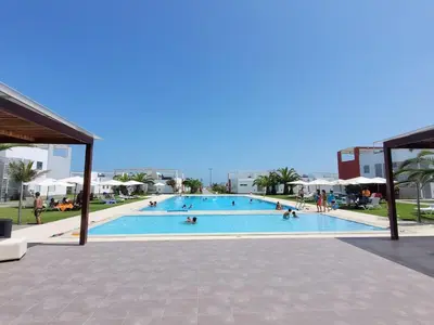 a large swimming pool with people in it at Casa de playa Cala del Mar Experience in Bujama Baja