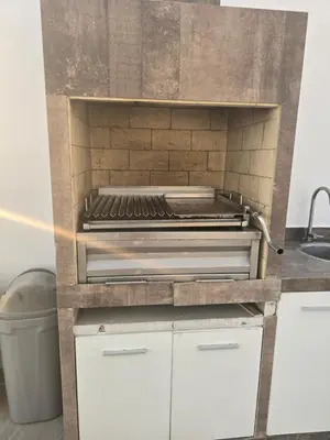 a kitchen with a grill on top of a counter at Casa de playa Cala del Mar Experience in Bujama Baja